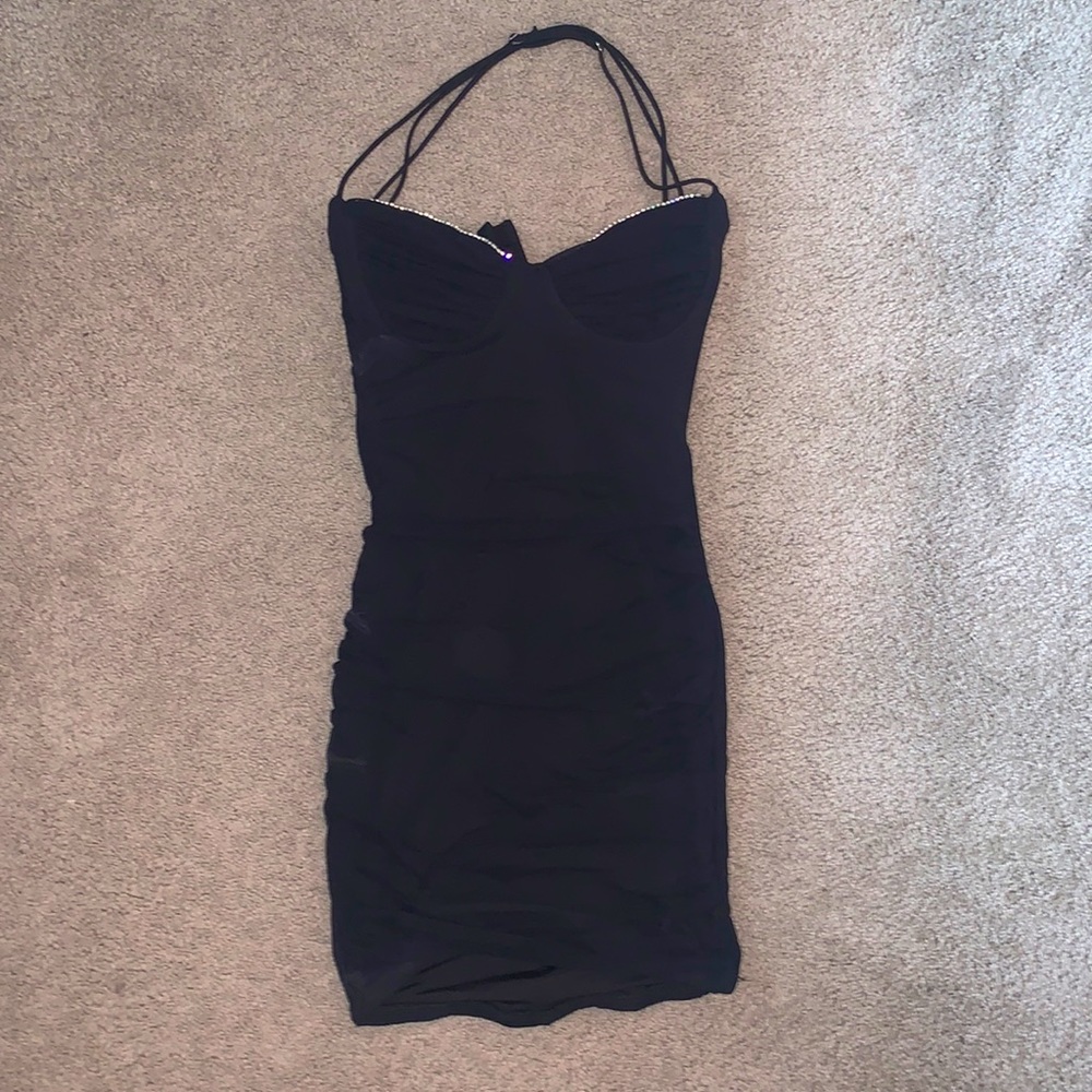 Bodycon short black dress with rhinestones.